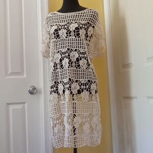 Beautiful lace beach/swim cover up. Worn once, tags cut out fits medium/large